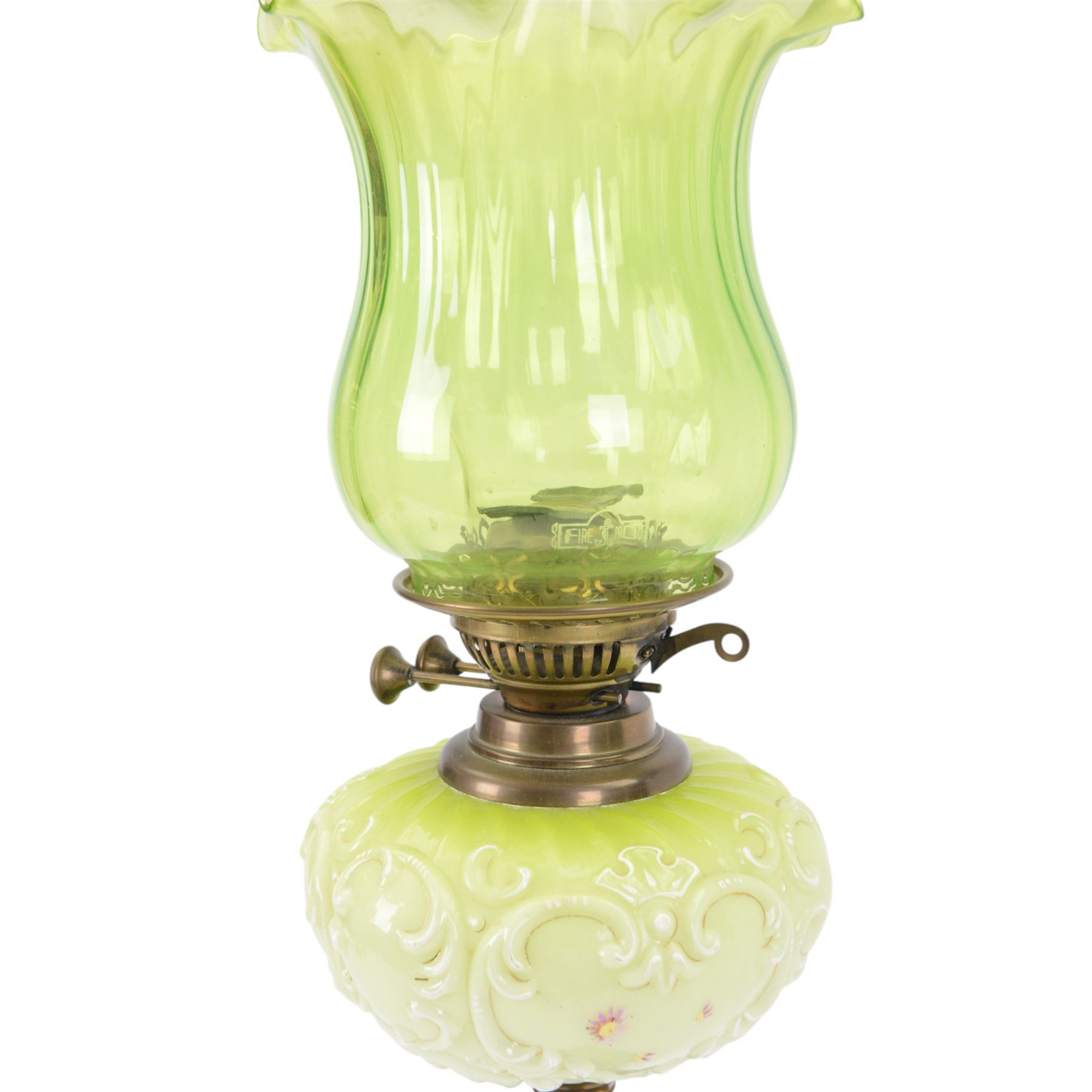 Green glass and brass oil lamps, with frilled glass shade, reservoir decorated with flowers, upon corinthian column with square base, H74cm