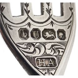 Victorian silver lidded trinket box, with embossed decoration by John Edward Wilmot, Birmingham 1900, silver bladed knife and fork with mother of pearl handles by Atkin Brothers, Sheffield 1862 and an embossed silver dish hallmarked (4)