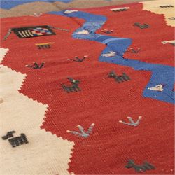 South West Persian Qashqai pictorial flatweave kilim, with central sinuous indigo river band dividing broad panels of madder red and camel yellow, red ground sparsely decorated with stylized animals, birds, and schematic shrubs, executed in bold geometric idiom, with fringe ends 