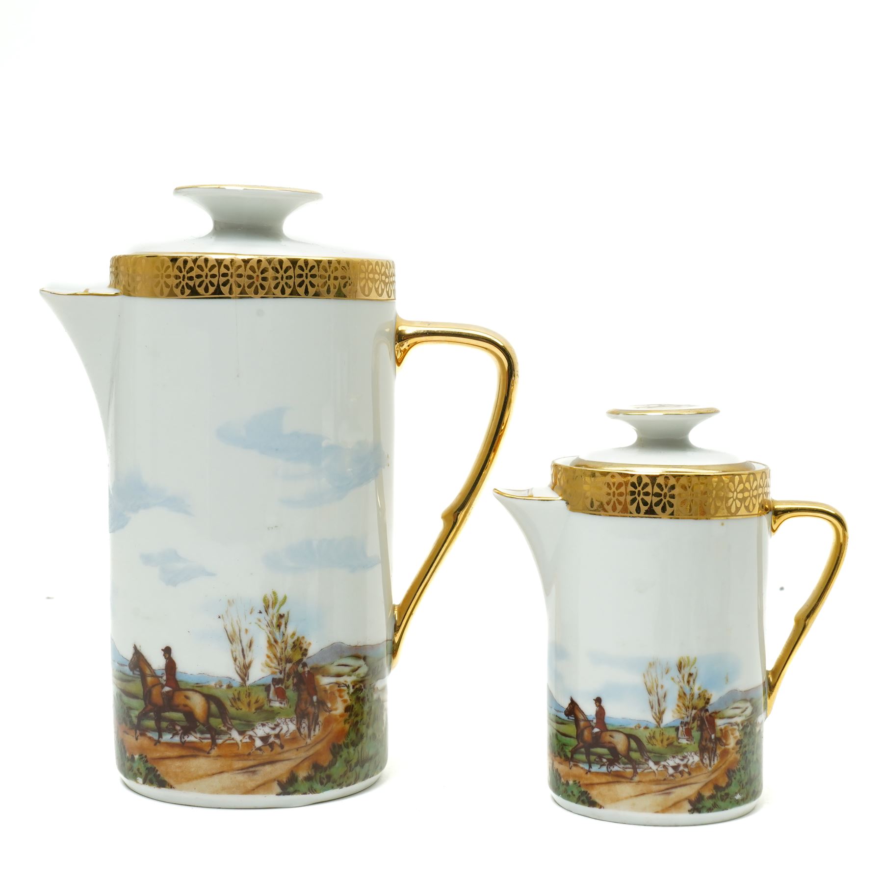 Limoges  coffee set decorated with hunting scenes within a gilt border comprising twelve cups and saucers, coffee pot, cream jug and sugar bowl