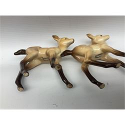 Collection of Beswick figures, comprising fallow deer family group, stag standing no.981, stag lying no.954, doe no.999a and two fawns no.1000b, together with badger family, boar no.3393, sow no.3394 and cub no.3392, all with printed mark beneath 