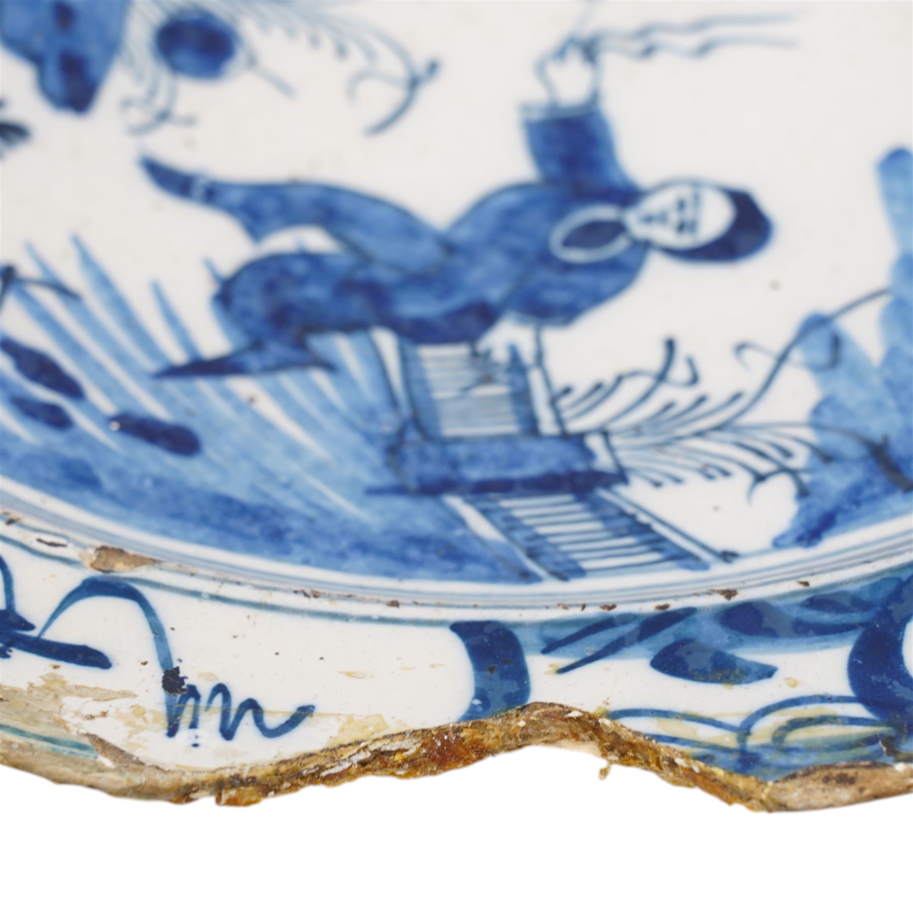 18th century English Delft dish, possibly Lambeth decorated with Chinese figure in a landscape D35cm
