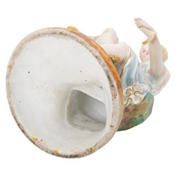  20th century bisque figurine, modelled as Artemis seated upon a rock, with impressed L&M mark beneath, H36cm