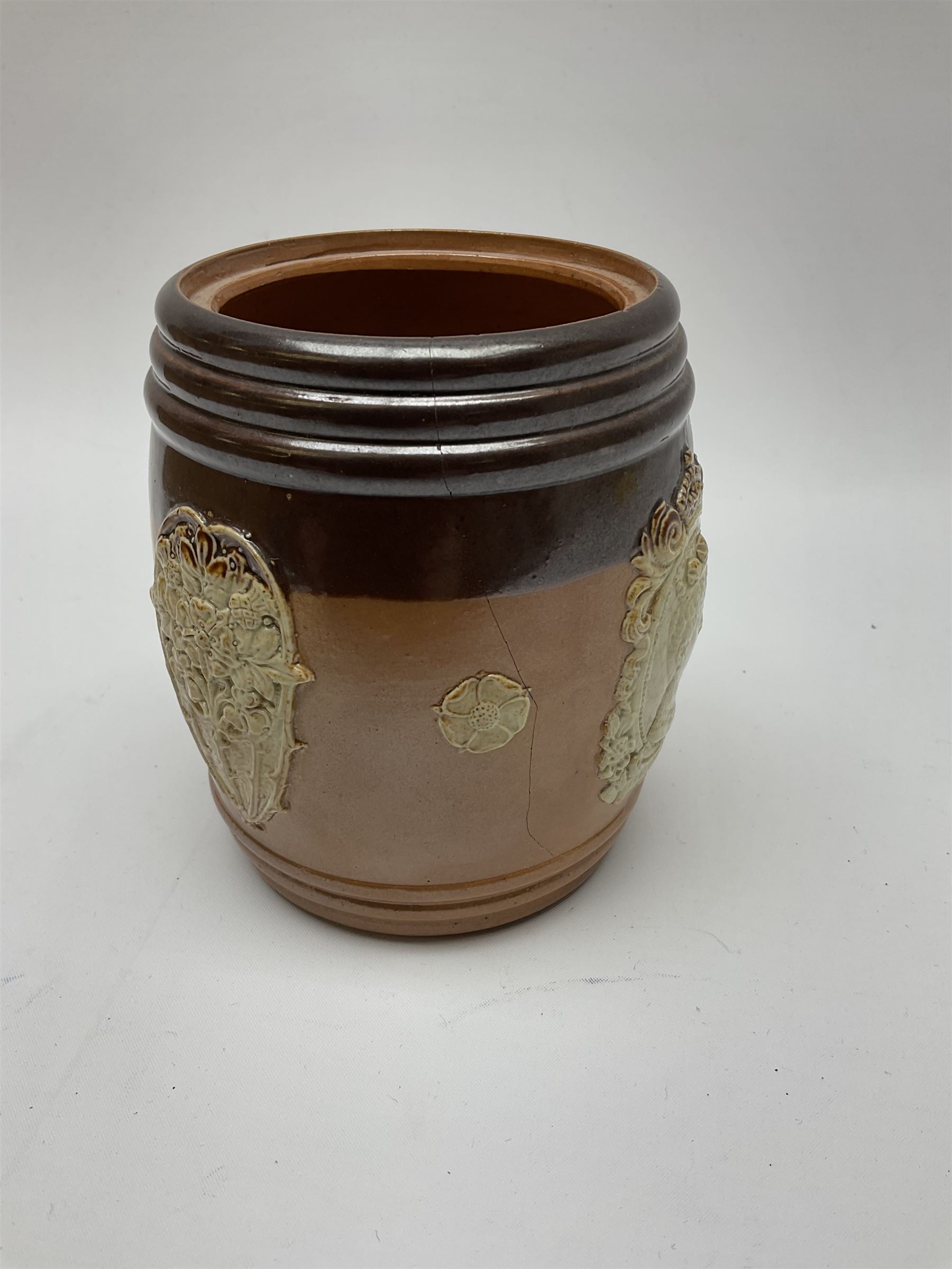 A group of Doulton Lambeth and Royal Doulton tobacco jars, most with relief moulded foliate decoration, (four examples lacking covers), largest example H15cm. 