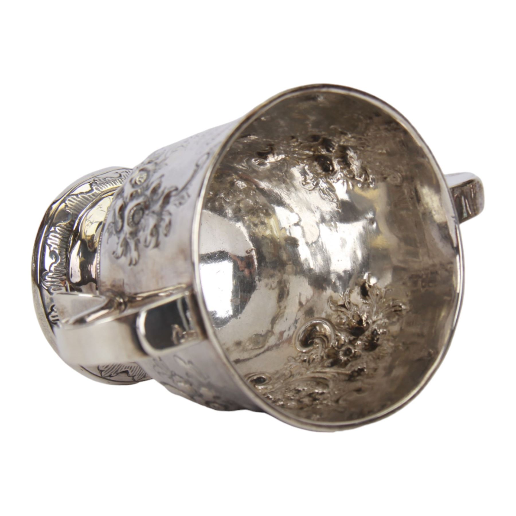 George I silver porringer, of typical form with flat capped twin curved handles,  the body with later presentation engraving surrounded by later embossed foliate decoration, upon a spreading circular foot, hallmarked Sarah Holaday, London 1723, H10.5cm