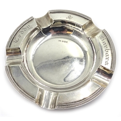 Silver twin handled bowl by Thomas Bradbury & Sons Ltd Sheffield 1902, 10cm and a silver ashtray by Walker & Hall Sheffield 1931, 13cm approx 7.2oz