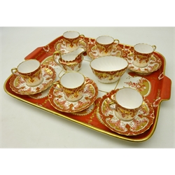  Late Victorian Spode Copeland cabaret set for six persons, comprising six fluted coffee cups and saucers, decorated with trailing flowers on iron red ground and gilding on a rectangular twin handed tray, pattern no.5535, L44cm x W35cm   