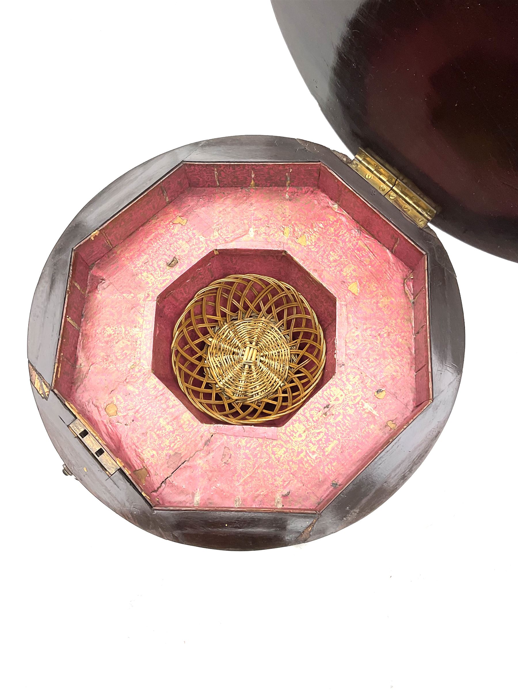 Victorian rosewood work table, circular hinged lid enclosing trumpet shaped body with fitted interior, scroll carved serpentine supports, on tripod base