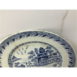 Late 18th/early 19th century Chinese blue and white export plate of circular form, with central panel decorated with river landscape incorporating trees and pagodas, with stylised borders, D23cm