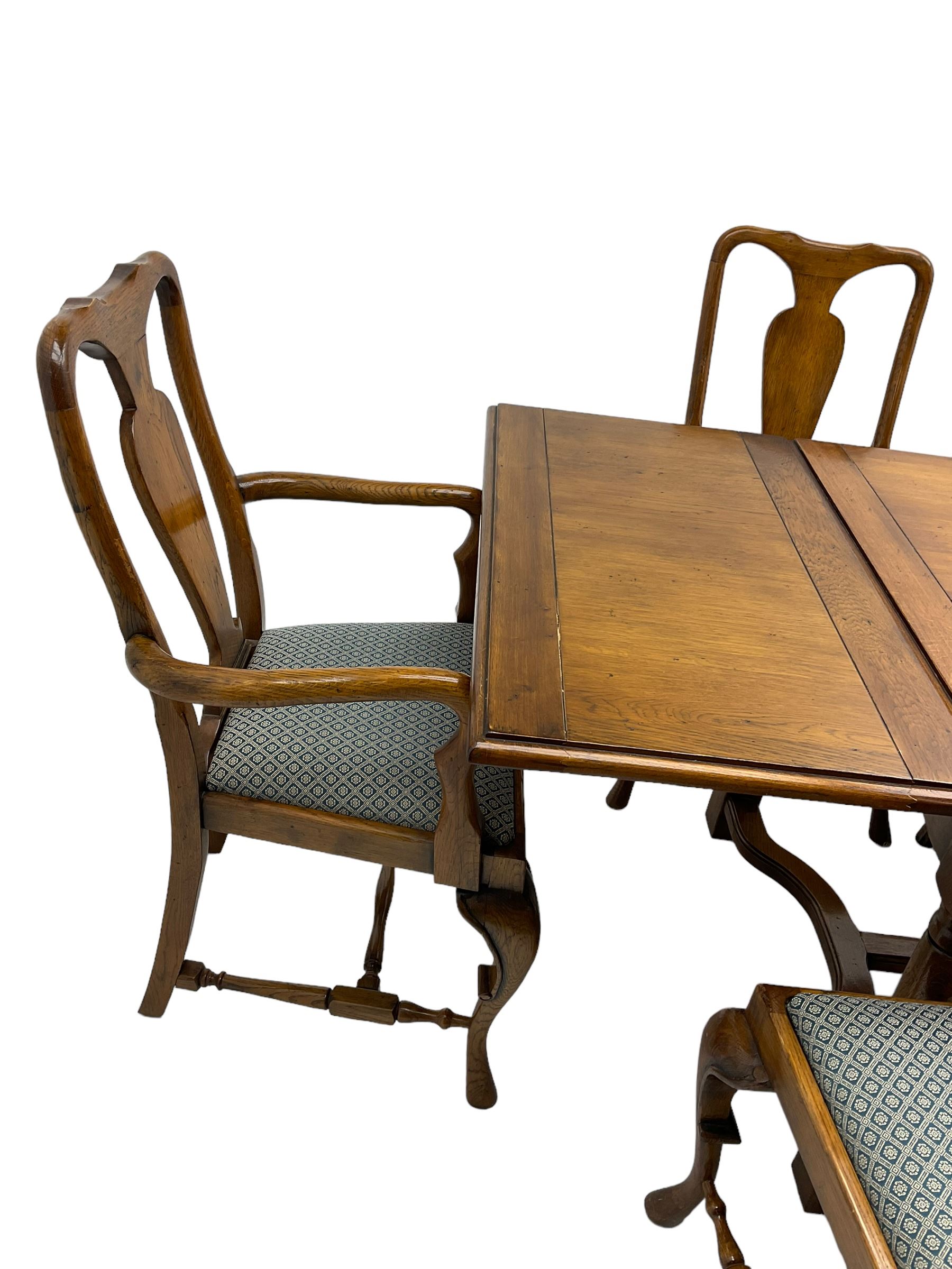 Late 20th century oak dining table, rectangular top with two draw leaf extensions, on turned supports united by moulded hayrake stretchers (180cm - 278cm x 90cm, H76cm); set of eight (6+2) oak dining chairs, shaped cresting rail over shaped splat back, upholster drop-in seat, on cabriole supports united by turned H-shaped stretchers 