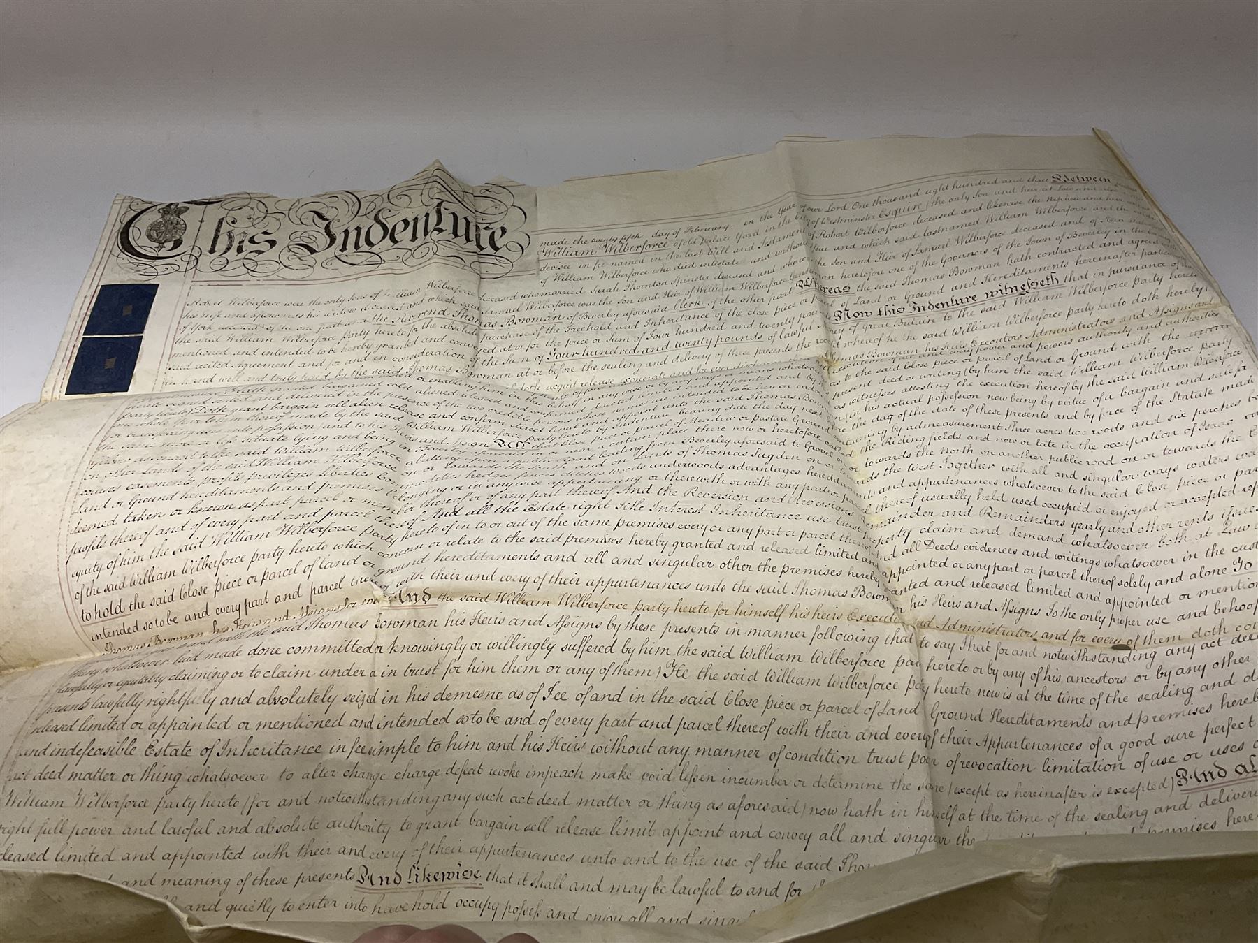 Early 19th century manuscript deed on vellum in three sections dated 25th February 1803 relating to 'An agreement between William Wilberforce, of the old palace yard, Westminster - son of Robert, AND The Reverend Thomas Bowman, of Beverley, who has agreed to buy from William Wilberforce the Freehold of a 