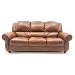 Violino three seat sofa upholstered in chestnut leather, turned supports (W207cm) and matching two seater (W155cm)