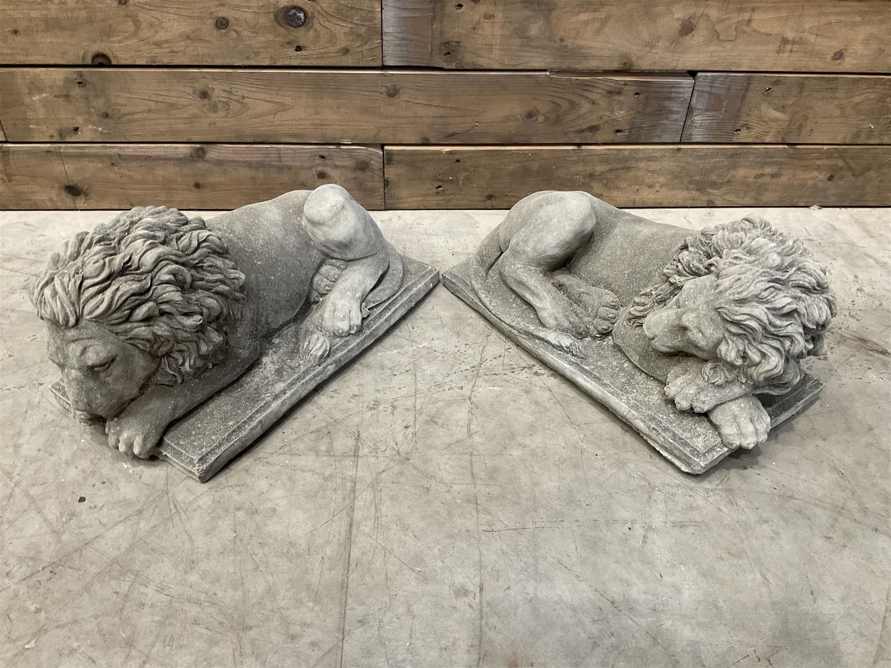 Pair of small recumbent garden lions