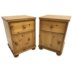 Pair of waxed pine bedside cabinets, fitted with single drawer over cupboard, on bun feet