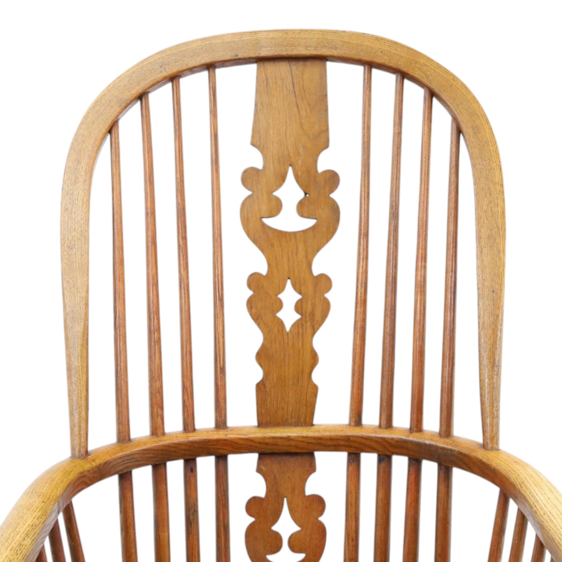 19th century elm Windsor armchair, with central pierced splat, flanked by spindles, dished seat, raised on turned supports united by H-stretcher