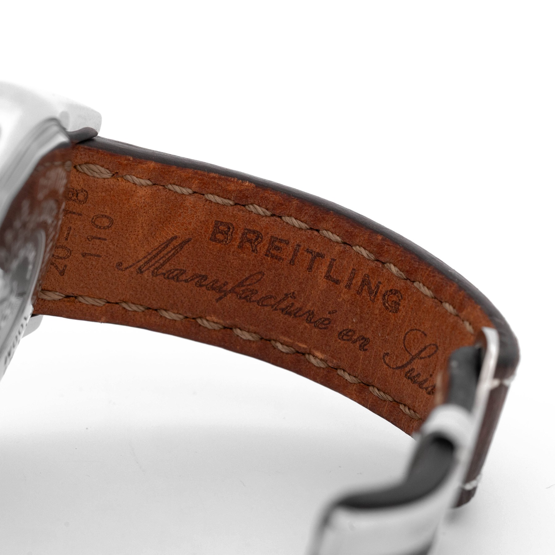 Breitling Chrono Cockpit gentleman's stainless steel diamond set automatic wristwatch, Ref. A13357, serial No. 2084732, cream dial with Roman numeral hour markers and date aperture, diamond set unidirectional rotating bezel, on Breitling brown leather strap, with fold-over clasp