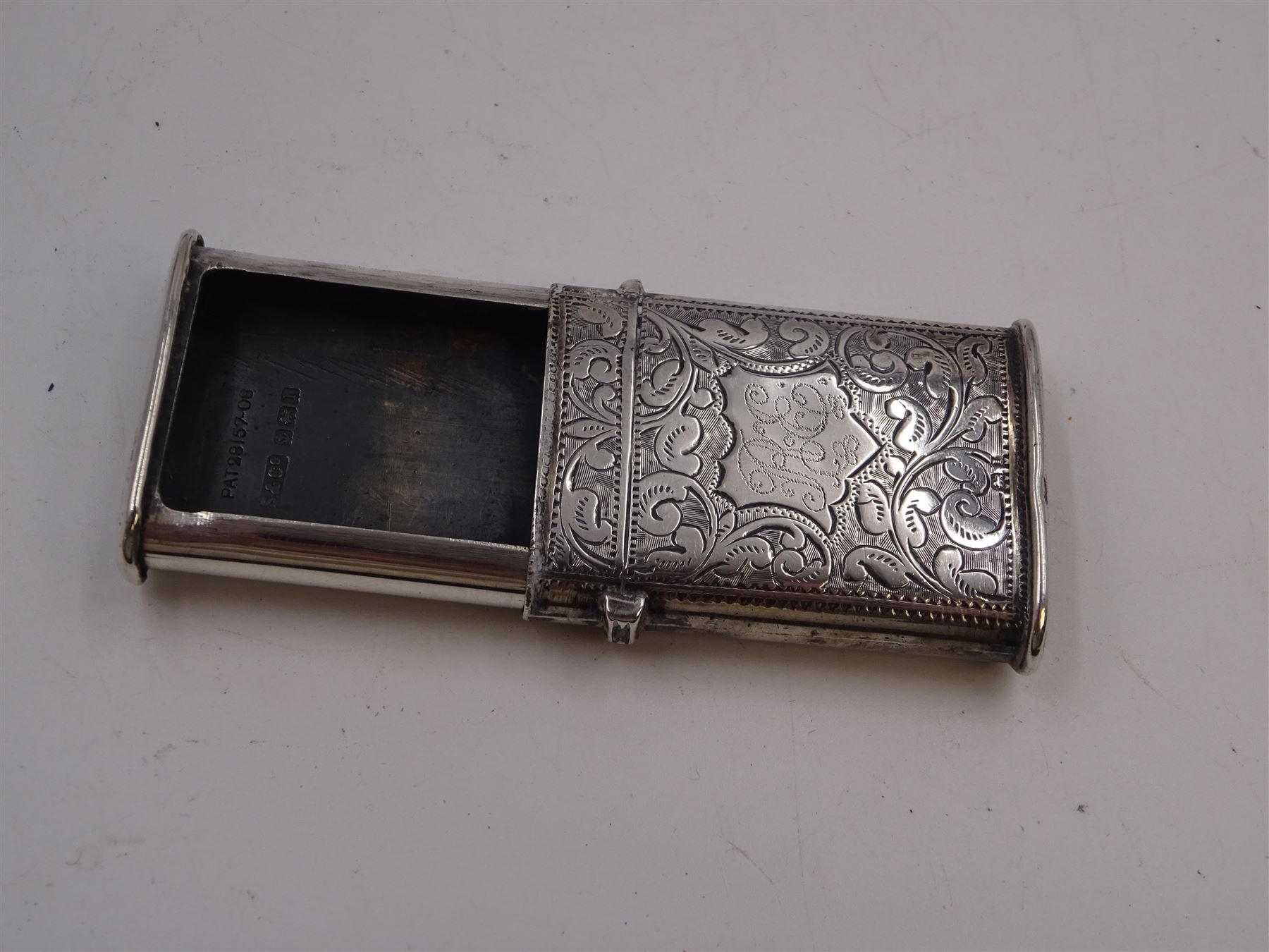 Five Victorian and later silver vesta cases, including Edwardian example with engraved sunburst decoration, hallmarked Abrahall & Bint, Birmingham 1905, and an early 20th century example with engraved foliate decoration and pull-out match compartment, hallmarked Sydney & Co, Birmingham 1910