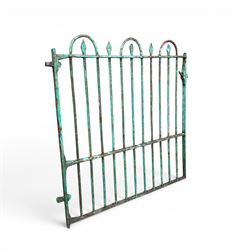 19th century French cast iron garden gate, finished in green rustic paint, bar form with hoop and spear top, with loop hinge brackets