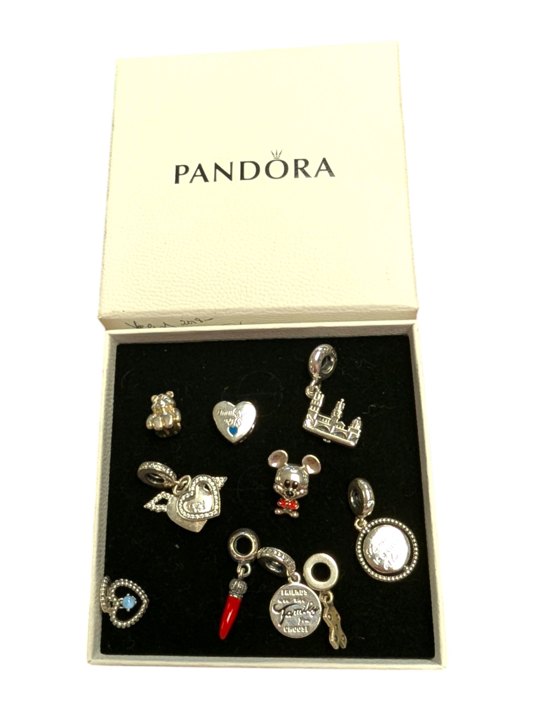 Ten silver Pandora charms, including Mickey Mouse, Pudsey Bear etc, all stamped S925 ALE, in one Pandora box