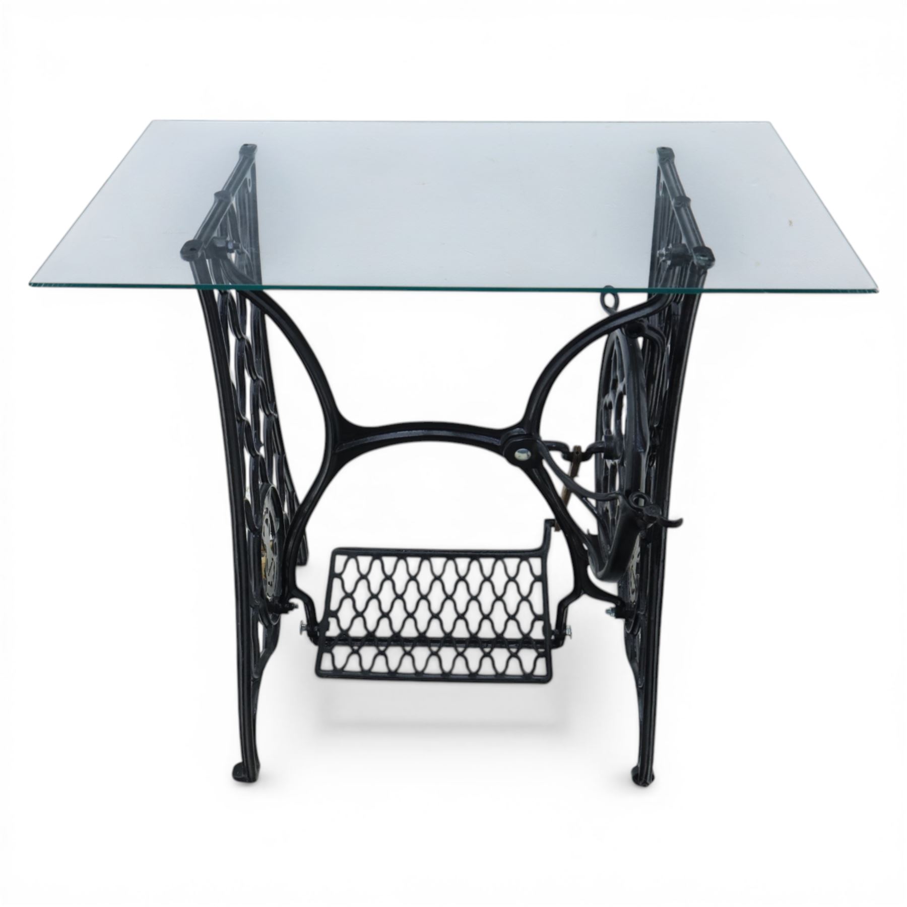 Sewing machine table with glass top, with Singer wrought metal base and foot pedal