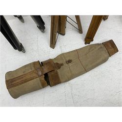 Three wooden adjustable tripods for plate cameras, together with a Linhof of Munchen metal tripod in a canvas case 