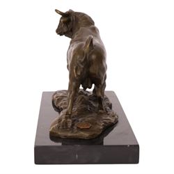 After Antoine-Louis Barye: bull upon naturalistic base, bronze, signed A Barye and bearing foundry mark, upon rectangular black stone plinth, overall H14cm L21cm