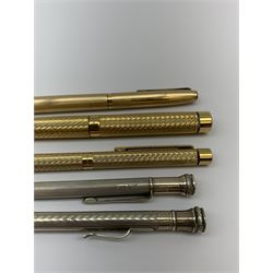 Gold-plated lighter by S.T Dupont, gold-plated roller ball pen by Yard-O-Led, gold-plated fountain pen and roller ball pen by Sheaffer, silver pencil by Walker & Hall, Birmingham 1961 and one other American silver pencil by Wahl Eversharp, stamped Stirling