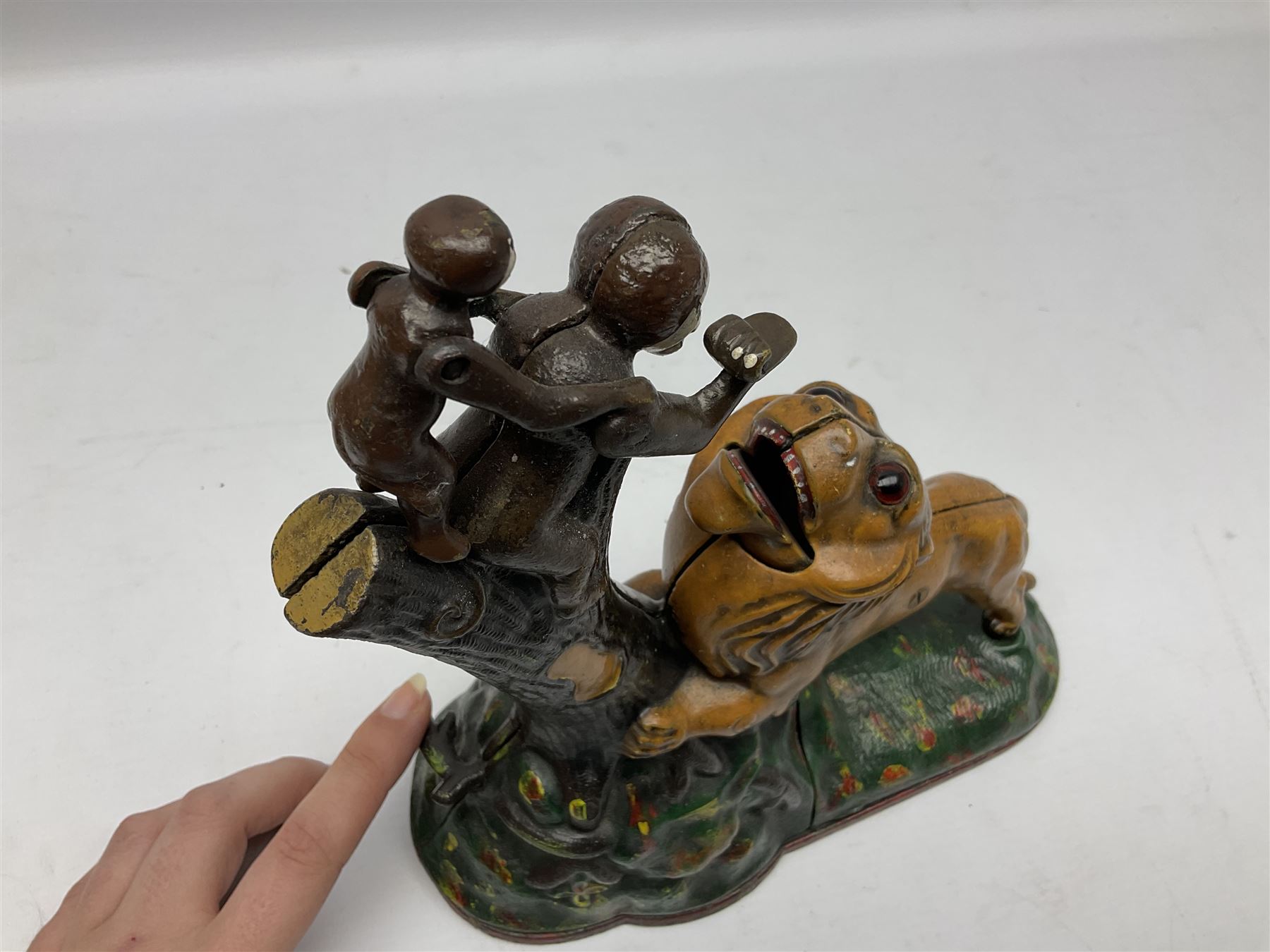 Late 19th century cast-iron mechanical money bank 'Lion and Two Monkeys' by Kyser & Rex with impressed patent mark for 17th July 1883 H25cm L23.5cm