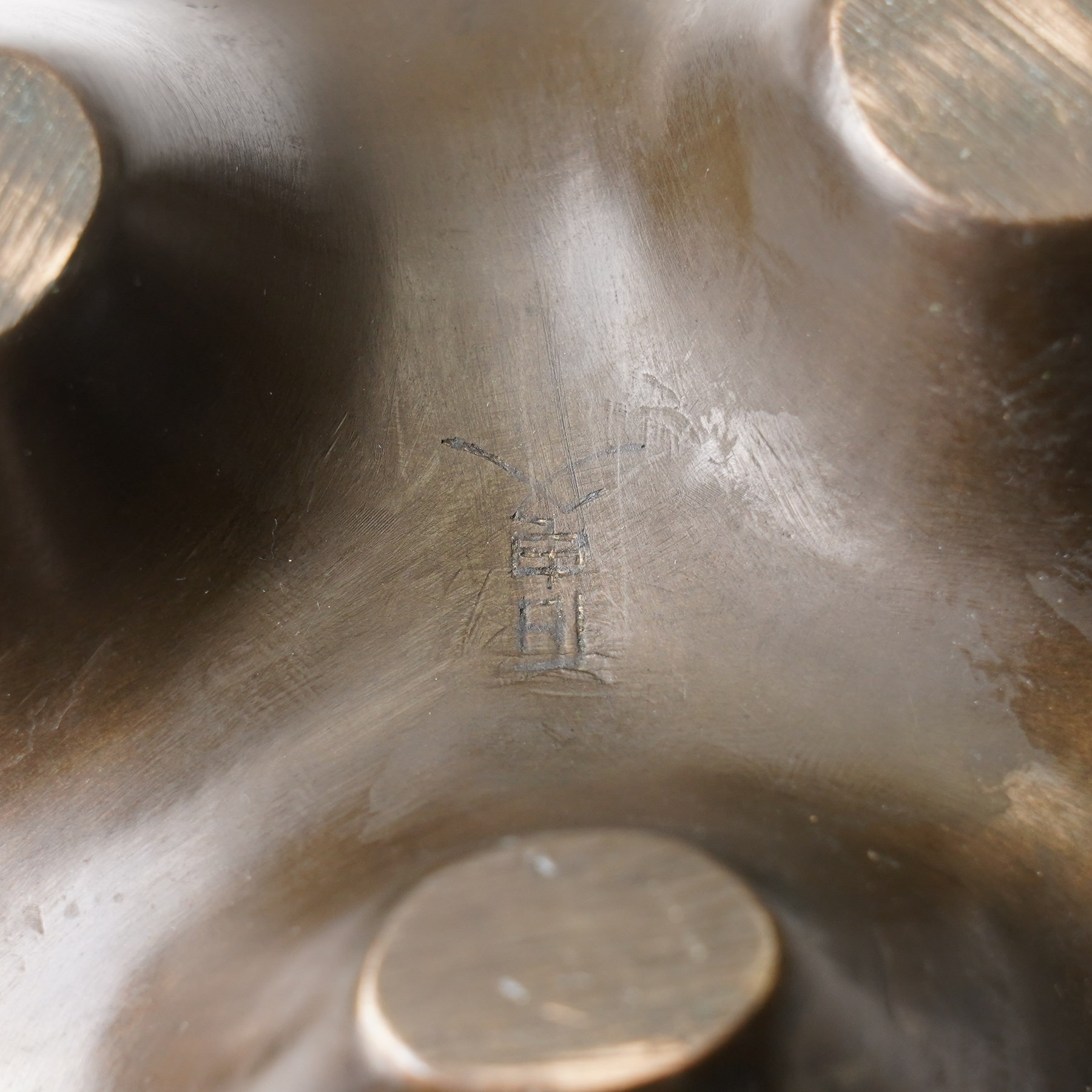 Chinese bronze tripod censer, of squat globular form, the body decorated with a band of Greek key motifs, the twin handles formed as two elephants heads, with incised shi shou two-character mark to base, H10cm