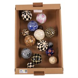 Collection of decorative spheres, including painted and ceramic examples 
