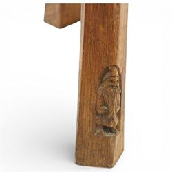 Gnomeman - oak circular stool, the top carved with continuous rosette and scrolling border, raised on three splayed supports, one leg carved with gnome signature, by Thomas Whittaker of Littlebeck