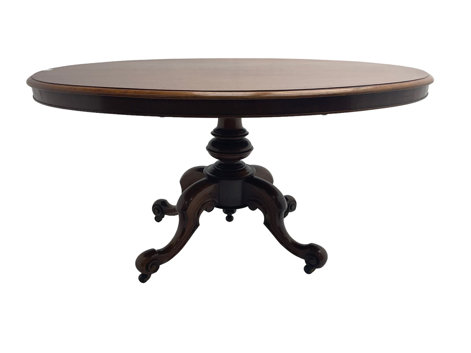 Victorian mahogany oval loo table, moulded edge with banded frieze, raised on baluster turned pedestal with quadrupod base, cabriole supports with scroll feet and castors