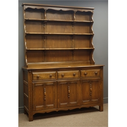  Ercol medium elm dresser, three heights plate rack, three drawers and three cupboard below, W146cm, H192cm, D52cm  