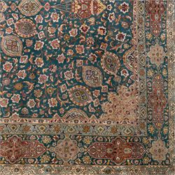 Persian Tabriz type carpet, the teal ground decorated with central medallion, radiating palmettes and dense floral scrollwork, within multiple floral borders