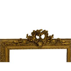 Gilt framed wall mirror, scrolled foliate cartouche pediment over frame decorated with foliage, plain mirror plate