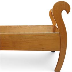 Unicornman - pair of craftsman-made oak single beds, of sleigh shape with scrolled head and foot-boards with octagonal stretchers, slatted base, raised on inward-splayed squared supports, applied with carved unicorn signature, by Geoff Gell of Coxwold