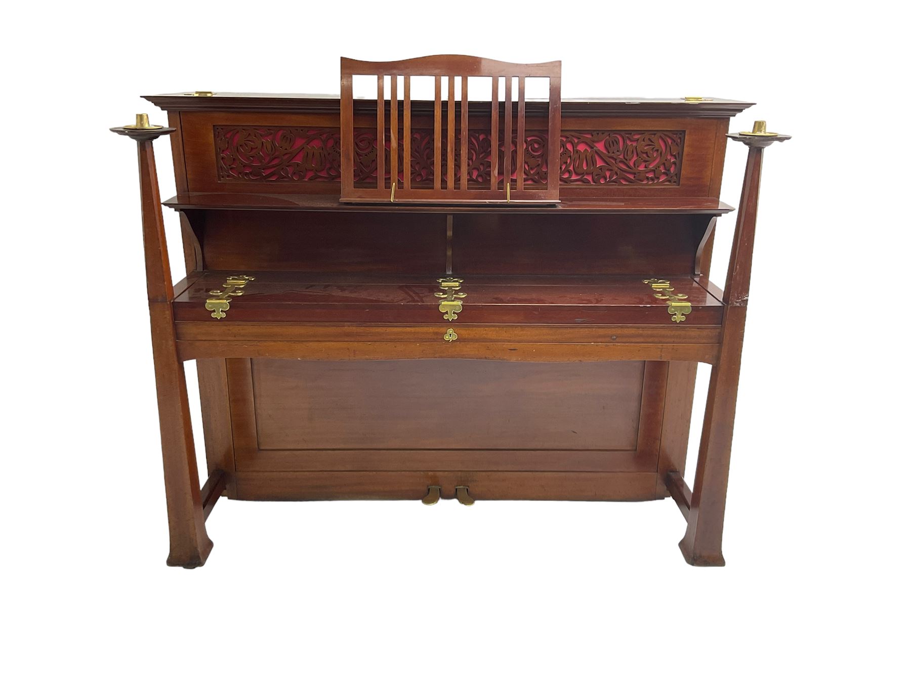 Carl Bechstein - late 19th century German overstrung upright piano, in a model 4 Arts and Crafts case designed by Walter Cave, with a lattice music desk and fretted silk backed front panel, brass hinged case lid and key fall with square tapered candle holders and circular sconces, iron frame, serial number 52187 (1899-1900), with an under damper action, 85 ebony and ivory keys, sustain and una corda pedals, original action, stringing, dampers, and action return straps, registered case number 328639, USA patent 24805.

This item has been registered for sale under Section 10 of the APHA Ivory Act