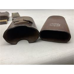 Victorian leather cigar protector with metal match striking plate on the end and internal spring to hold the cigars in place; expands for differing lengths of cigar, minimum L12.5cm; another similar leather cigar case marked Middlemore's Patent with attached vesta case and striker; three Bryant & Mays tin-late matchbox holders including 1935 Jubilee; and small box of matches (6)