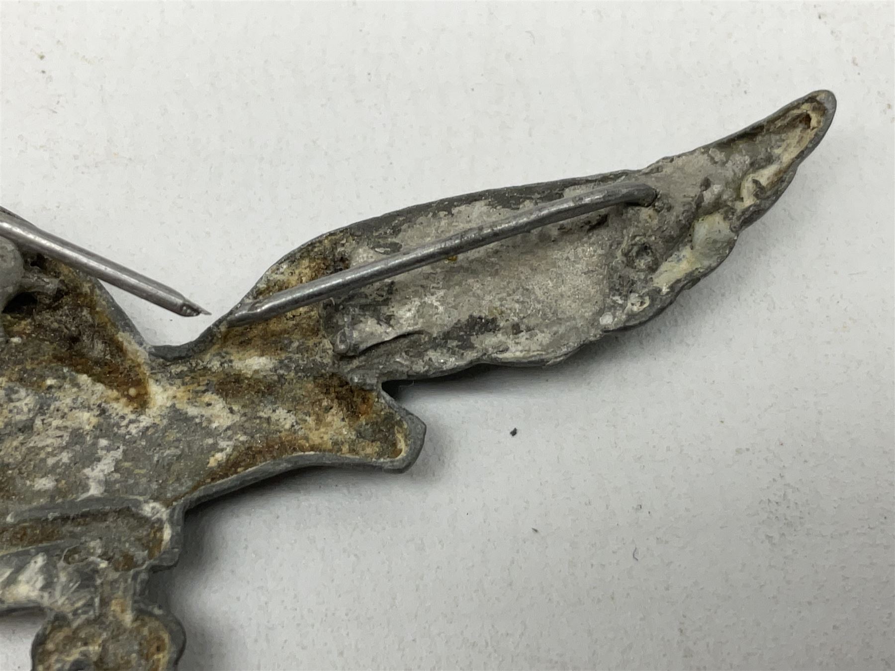 Five WW2 German peaked cap badges, four with double-pinned backs