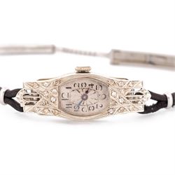 Art Deco 18ct white gold diamond ladies manual wind wind wristwatch, silvered engine turned dial with Arabic hour markers, the pierced design case milgrain set with single cut diamonds, Glasgow import mark 1928, on black cord strap, with stainless steel clasp