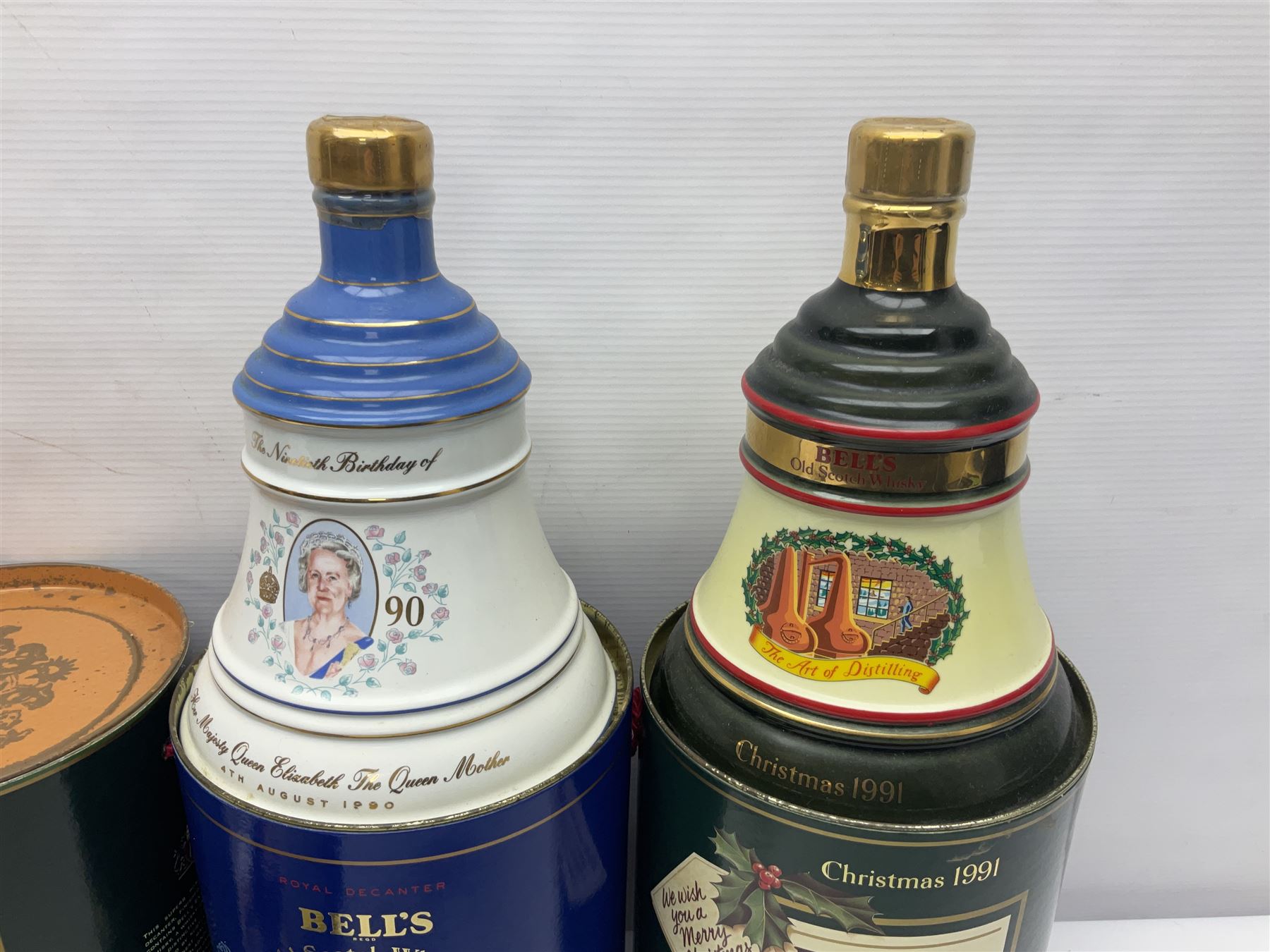 Bells, Scotch whisky, in seven Wade ceramic decanters, including Christmas 1988, 1989, 1990, 1991 etc