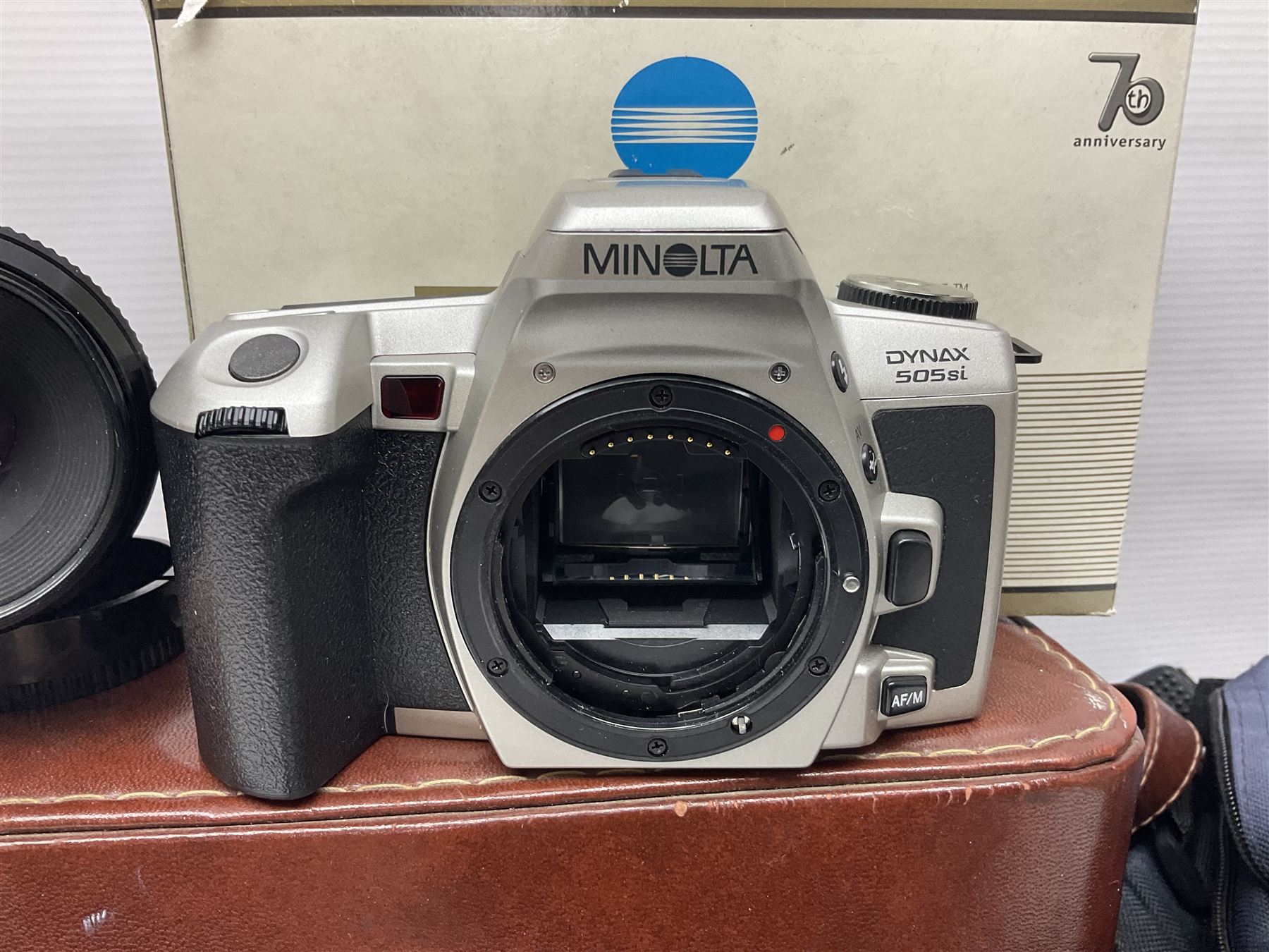 Four Minolta camera bodies, to include Dynax 500si, serial no. 94812651 with 'Signa Zoom 1;3.5-4.5 f=28-70mm' lens, Maxxum 300si, serial no. 97821665, with 'Tamron AF 80-210mm' lens and Dynax 300si, serial no 01603265'  with Minolta AF Power Zoom 35-80mm 1;4' lens, etc, together with Pantax MV1 camera bodies and other camera equipment 