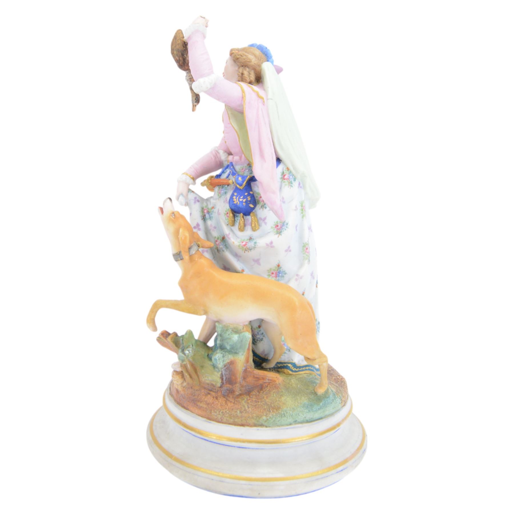Late 19th/early 20th century Continental bisque figures, the larger modelled as a pensive female figure sitting upon a well, upon an oval naturalistically modelled base, H39cm, the smaller modelled as a hunts woman holding a bird aloft, with hound by her side, upon a socle base, H35cm