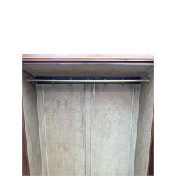 Late Victorian walnut triple combination wardrobe, projecting moulded and dentil cornice, central shaped bevelled mirror glazed door, cartouche and curled leaf carved panels over figured walnut veneered panels, fitted with drawer to base, on bracket feet