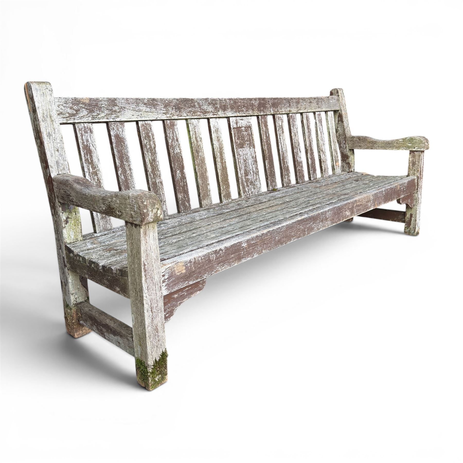 Teak garden bench with slatted back and seat on square supports in weathered which finish 