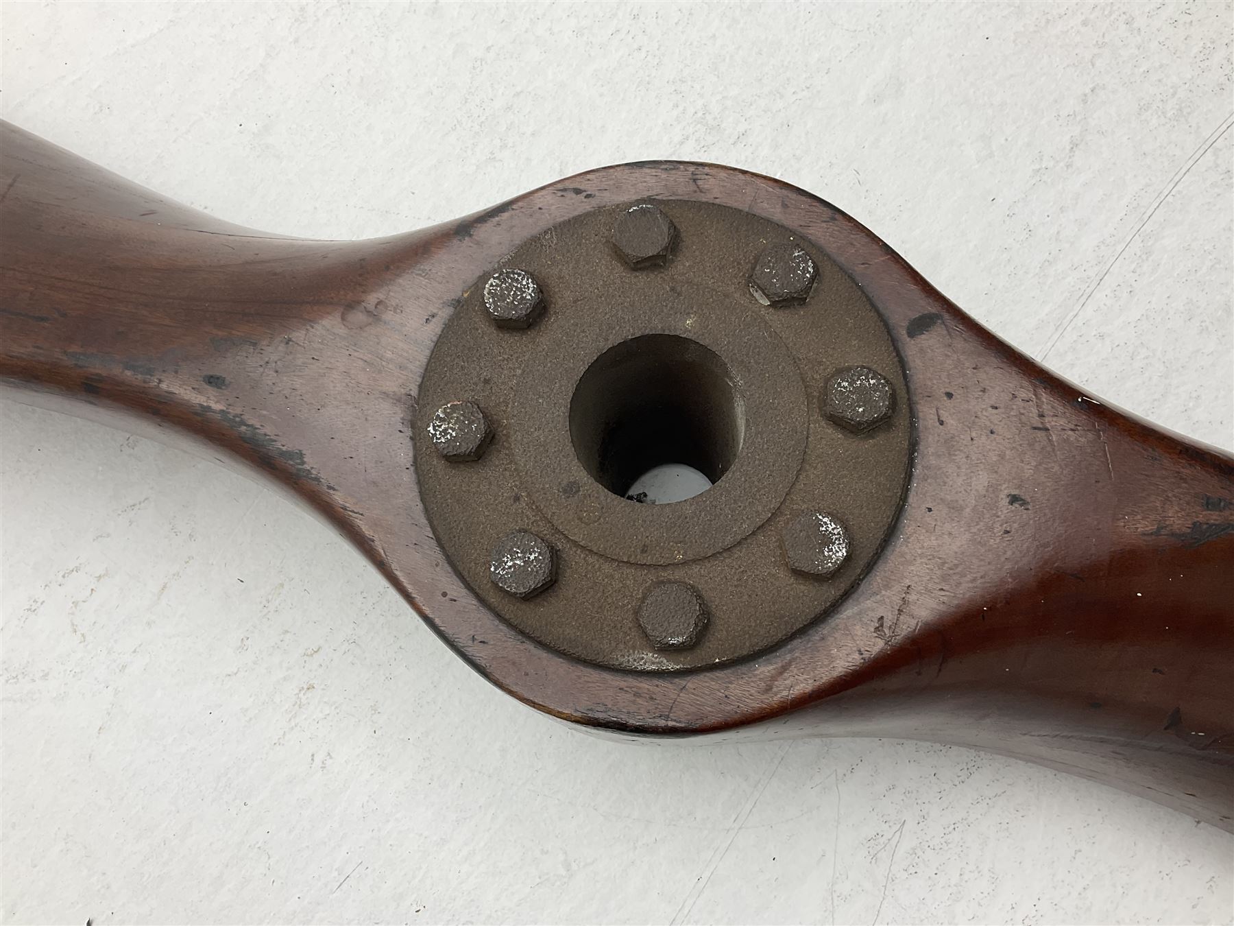 Early 20th century Avro 504 80HP Gnome laminated mahogany two-blade propeller with metal centre to the hub, stamped to the face of the hub 'AVRO Y80 80HP GNOME TYPE 504 & 504A A.I.D.29 A.I.D.32 1545' and to the sides of the hub '2744 DIA 1829 PITCH' and '1470'; traces of A.V. Roe & Co Ltd Manchester transfers to both blades L273.8cm; Auctioneer's Note: The Avro 504 was introduced in 1913 and was quickly taken up by the Royal Flying Corps as a trainer and observation machine; robust and versatile it remained in general service as a trainer until the late 1920s then widely for civilian use as a joy-rider and for stunt displays. The legendary RAF WWII ace, Douglas Bader, took instructions and would have had his first solo flight in just such a machine.
