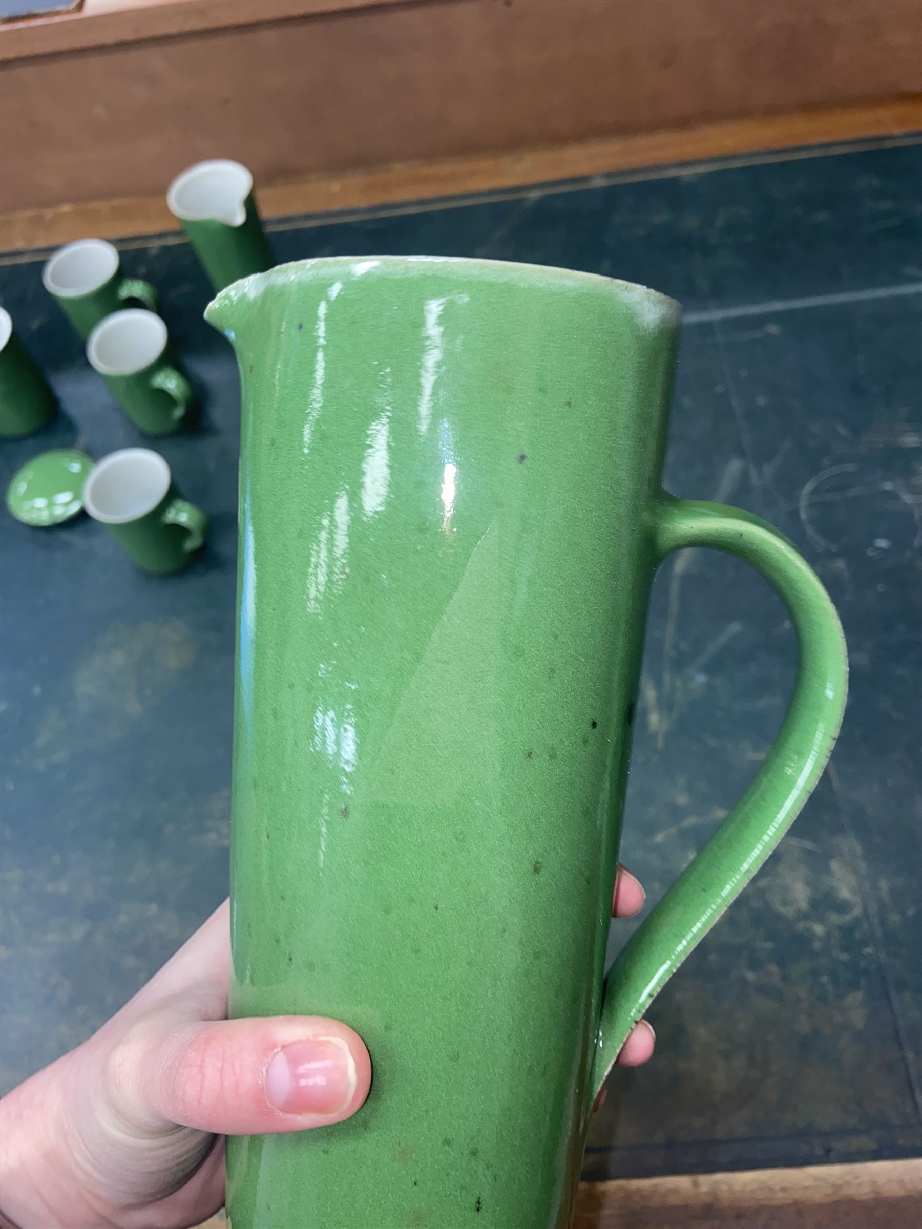 Rupert Spira (born 1960) stoneware coffee service decorated with vivid green glaze, comprising coffee pot, three cups, lidded sucrier and milk jug, all having impressed RS marks beneath, tallest H25cm