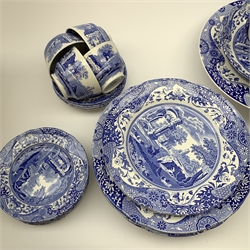 A collection of Spode Italian blue and white ceramics comprising nine dinner plates, four side plates, six tea plates, five cups & saucers, jug, cake stand, sandwich plate, circular bowl, mug and three bonbon dishes.
