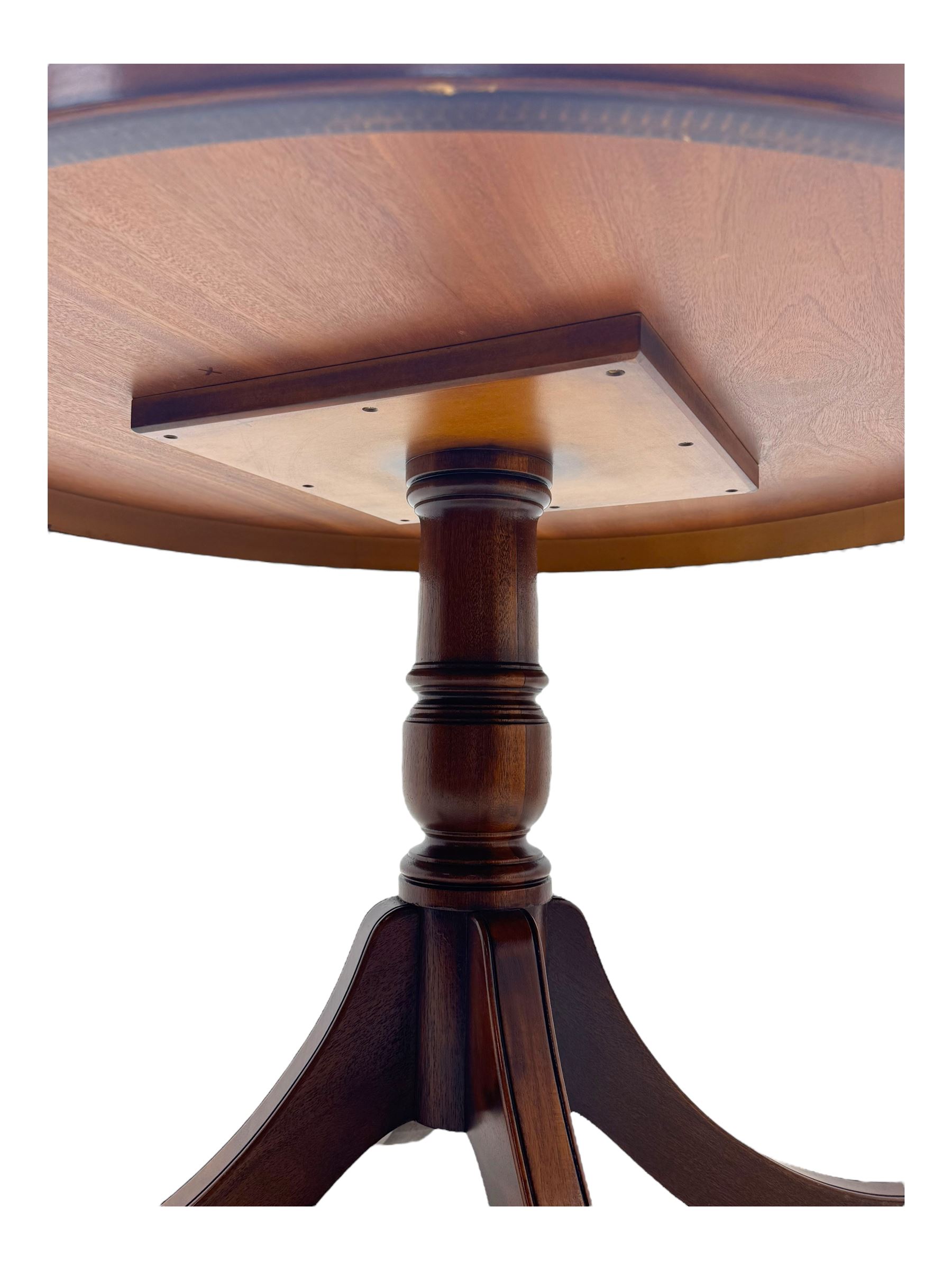 Ian Smith Furniture - Georgian design walnut centre table, the circular banded top with fluted edge, supported by a turned pedestal base with four splayed supports, each terminating in brass castors with claw caps; set of four mahogany dining chairs each with pierced vase-shaped splats and upholstered seats