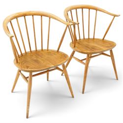 Ercol - pair of 'Cowhorn' elm carver chairs, curved back raised on nine stretchers, elm dished seats, raised on tapering supports